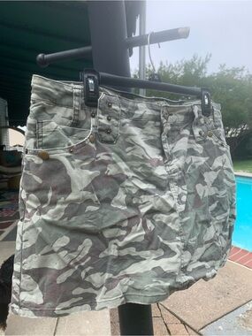 lei Women's Camo Skort in Green and Brown/pockets with metal studs.